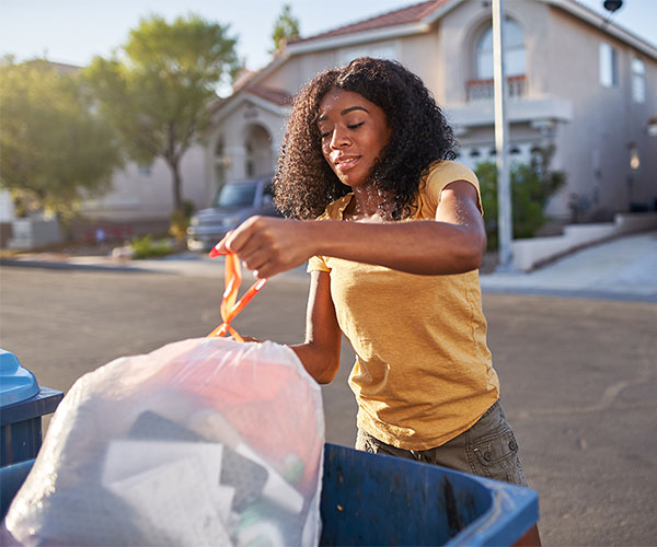woman taking out trash